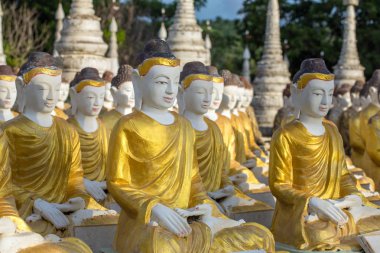 Buddha statues at the Maha Bodhi Tataung in Monywa Myanmar. clipart