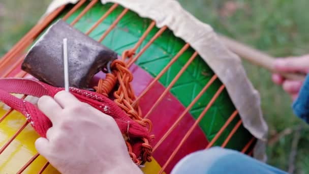 Man playing at Kenkeni Dunun Bass Drum with stick in slow motion — Stock Video