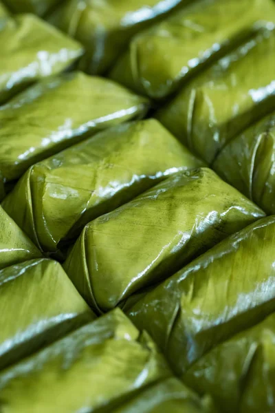 Glutinous rice steamed in banana leaf Khao Tom Mat or Khao Tom Pad food background — ストック写真
