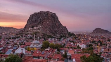 4K Sunset Time lapse of the Afyon city cityscape with Afyon castle on the rock