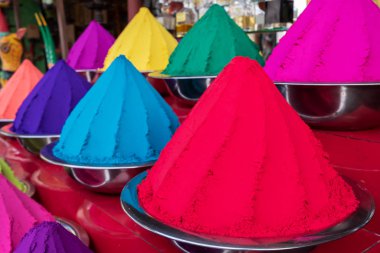 Colorful piles of powdered dyes used for Holi festival