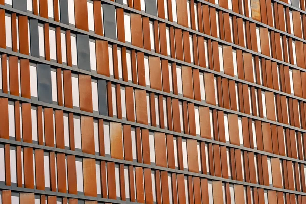 Facade of the modern office building made of window wooden shutters. — Stock Photo, Image
