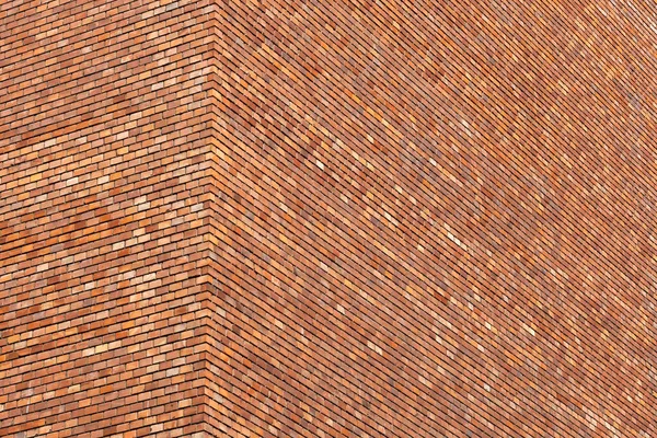 Vermelho tijolo edifício parede canto de perto — Fotografia de Stock