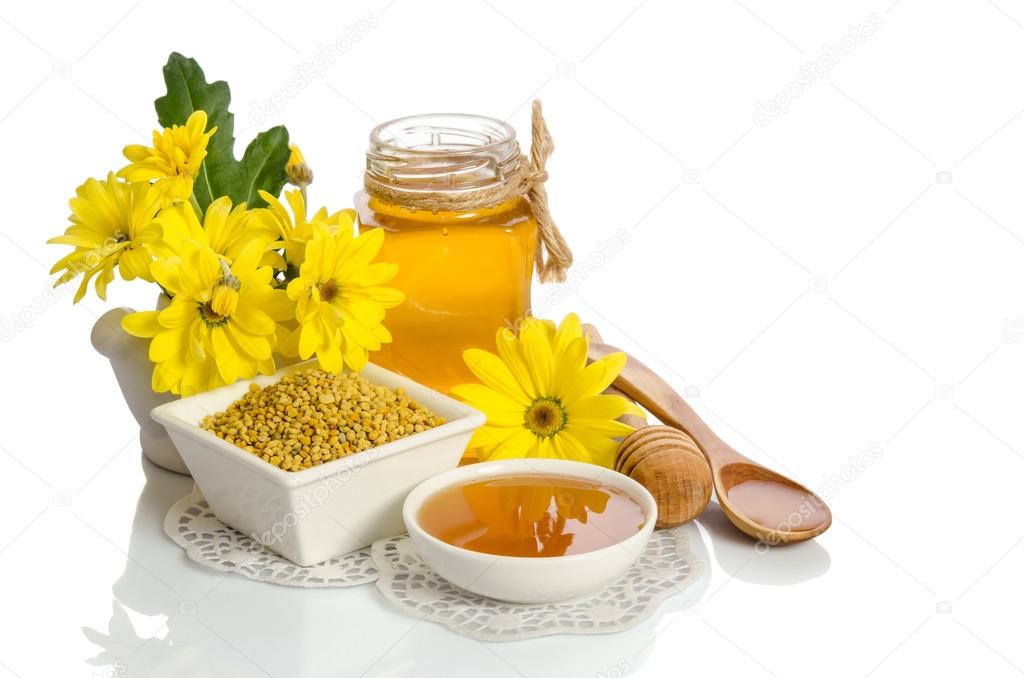 Yellow flowers and bee products (honey, pollen) isolated on whit