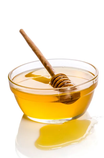 Bowl of honey isolated on white background — Stock Photo, Image