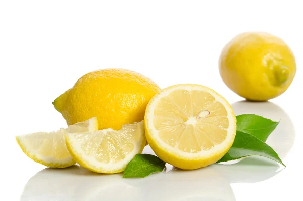 Two lemons and half with leaves  isolated on white background — Stock Photo, Image