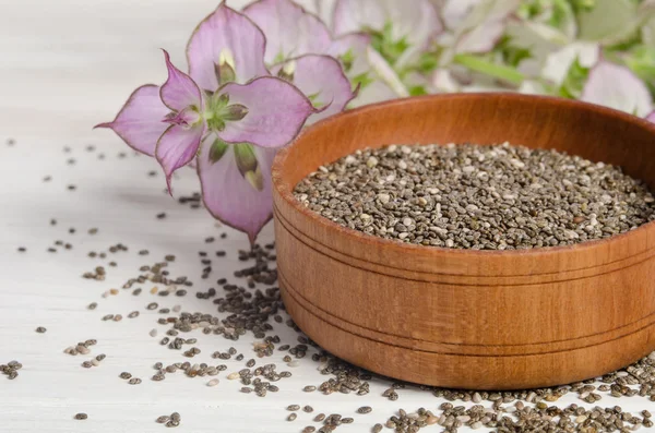 Chia seed healthy super food with flower over white wood backgro — Stock Photo, Image