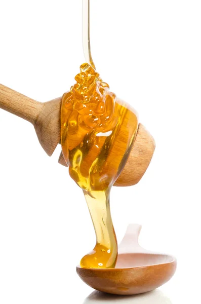 Honig tropft aus einem Holzwagen Stockfoto