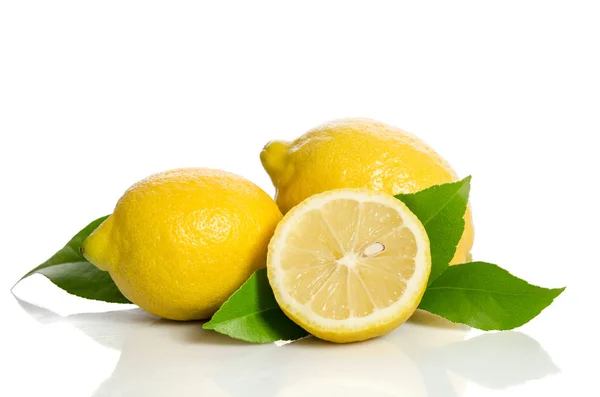 Two lemons and half with leaves  isolated on white background — Stock Photo, Image