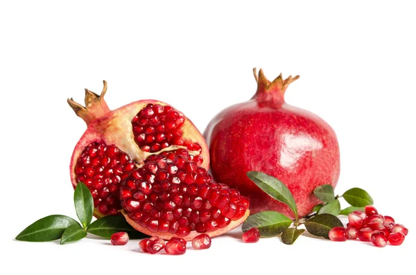 Whole Pomegranate and two parts of Pomegranate with leaves and s — Stock Photo, Image