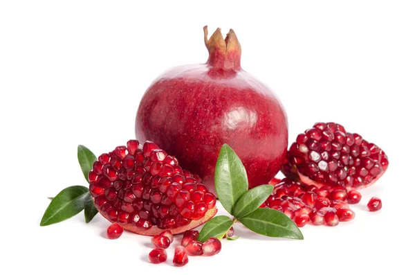 One whole and part of a pomegranate with pomegranate seeds and l — Stock Photo, Image