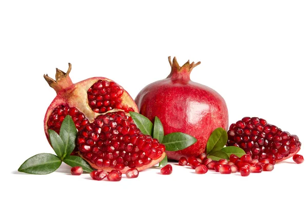 Whole Pomegranates and three part of Pomegranate with leaves and — Stock Photo, Image