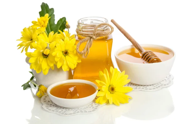 Yellow flower and bee products (honey, pollen) isolated on white — Stock Photo, Image