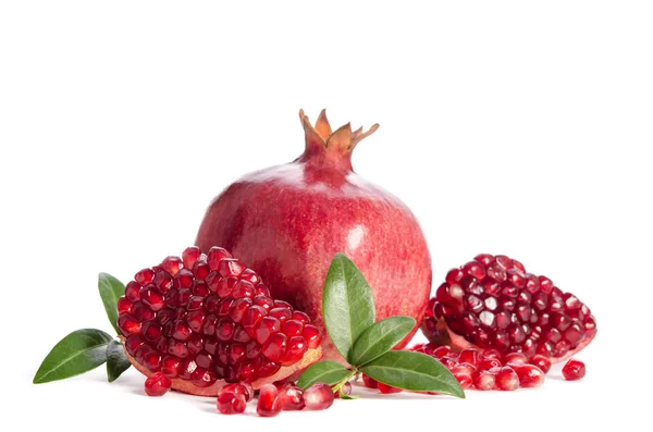 One whole and part of a pomegranate with pomegranate seeds — Stock Photo, Image