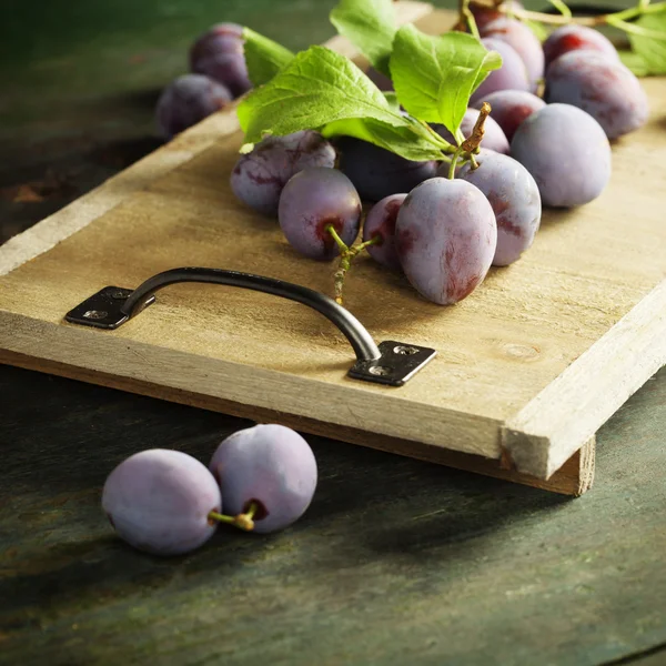 Sweet plums on wooden background — Stock Photo, Image