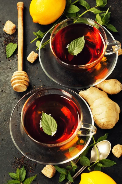 Hot tea cups with mint, lemon and sugar — Stock Photo, Image