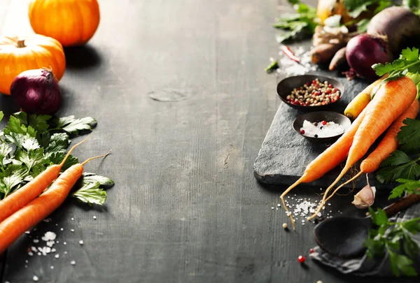 Vegetables on dark rustic table — Stock Photo, Image