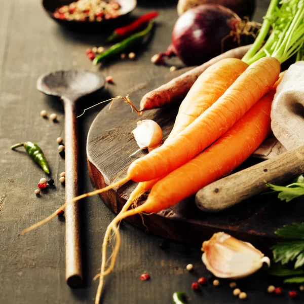 Vegetables on dark rustic table — Stock Photo, Image