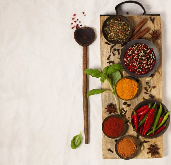 Different spices in bowls on table — Stock Photo, Image