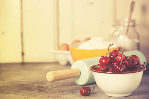 Mixed berries, baking ingredients and utensils — Stock Photo, Image