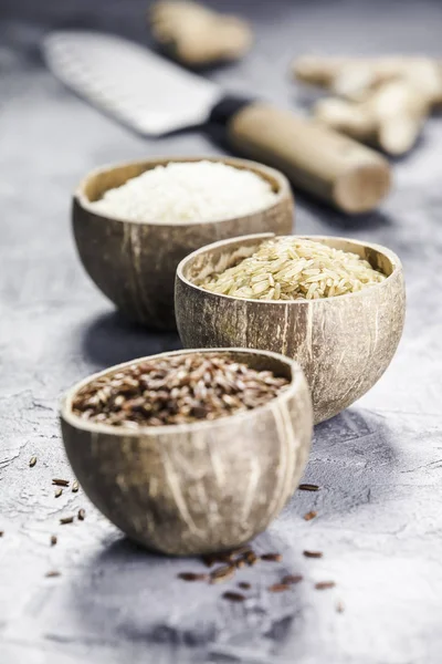 Assortment of different rice in bowls — Stock Photo, Image