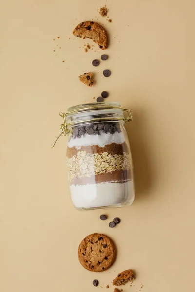 Chocolate chips cookie mix in glass jar — Stock Photo, Image