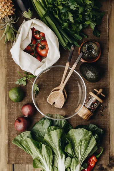 Fresh organic ingredients for salad making on rustic background — Stock Photo, Image