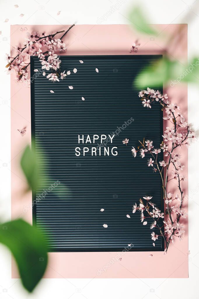 Easter background with letter board and spring flowers