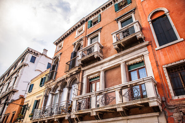 VENICE, ITALY - AUGUST 17, 2016: Famous architectural monuments and colorful facades of old medieval buildings close-up on August 17, 2016 in Venice, Italy.