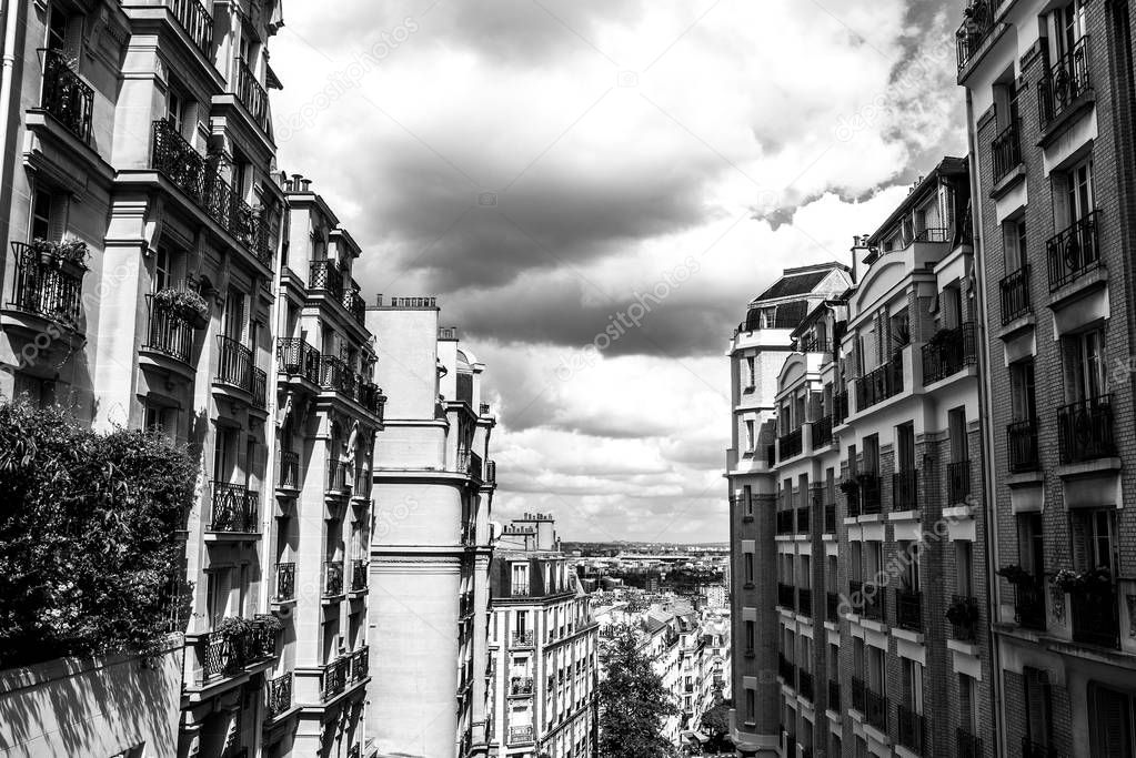 View from Montmartre to summer Paris and beautiful cloudy sky. Paris, France.