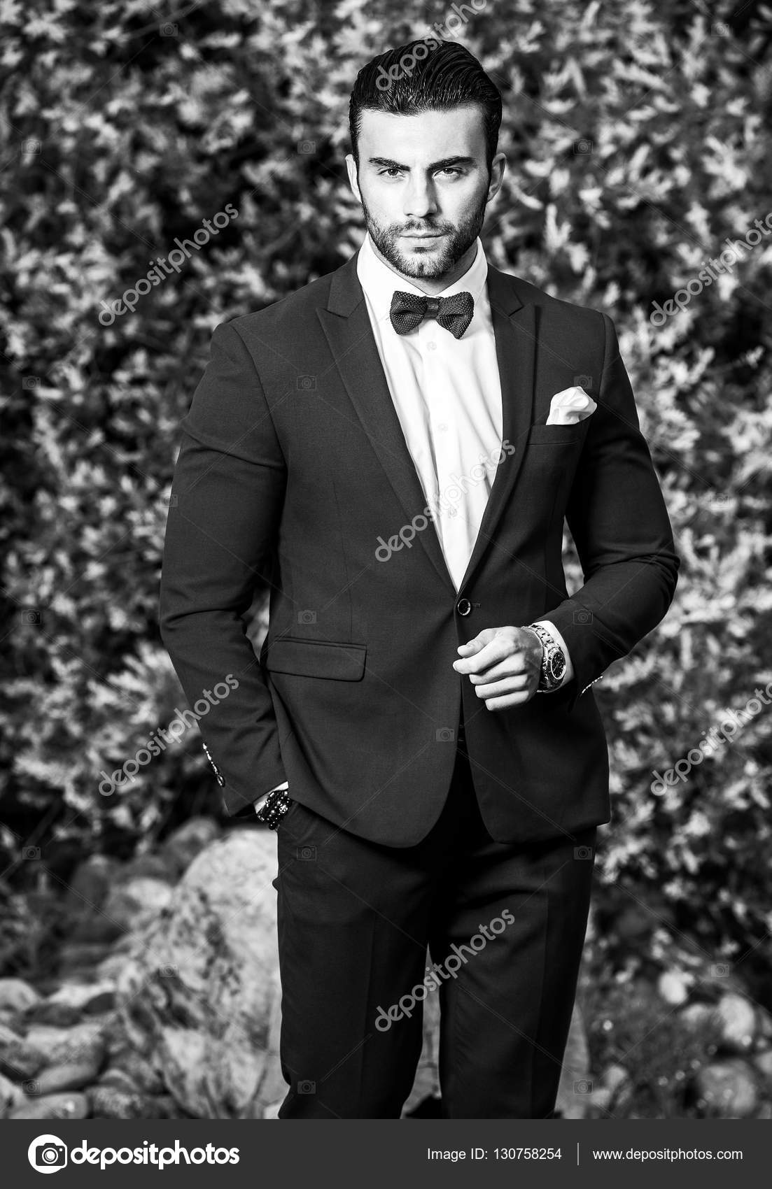 Black-white outdoor portrait of elegant handsome man in classical suit ...