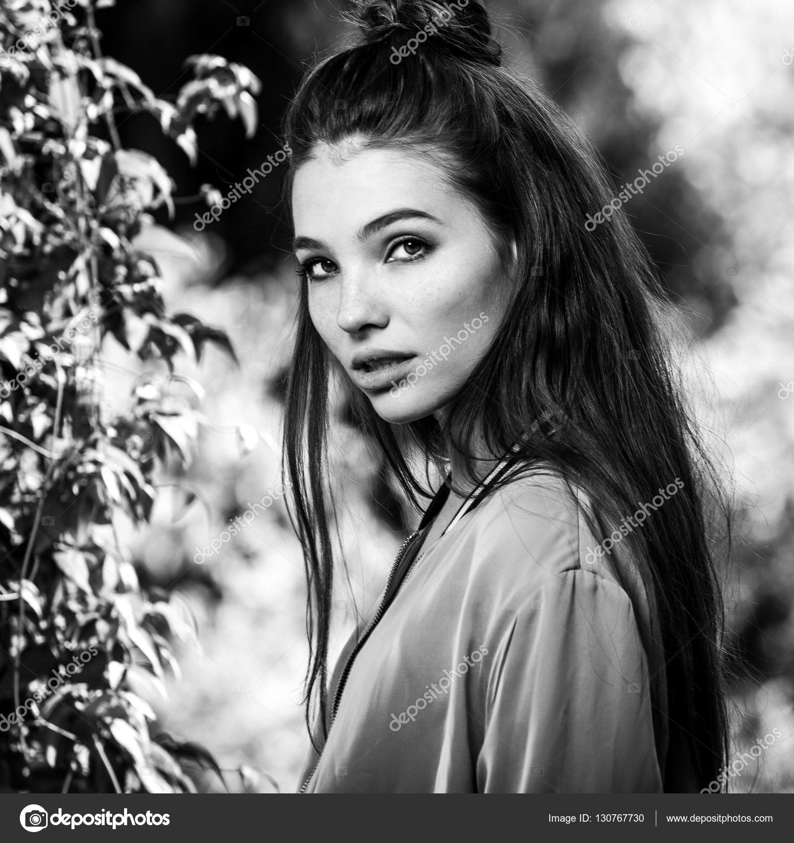 Black white outdoors portrait of beautiful emotional positive young woman photo photo by innervision