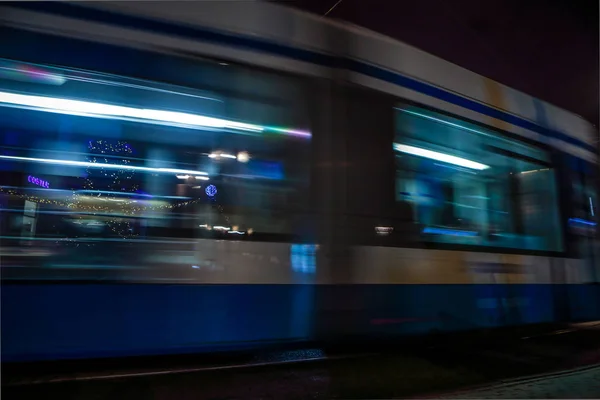 AMSTERDAM, NETHERLANDS - JANUARY 09, 2017: Blurred silhouette of moving tram in Amsterdam city at night. January 09, 2017 in Amsterdam - Netherland. — Stock Photo, Image