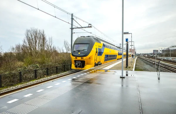 AMSTERDAM, NETHERLANDS - DECEMBER 28, 2016: Railway or railroad tracks for train transportation on 28 December in Amsterdam, Holland — Stock Photo, Image