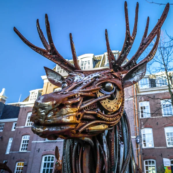 AMSTERDAM, NETHERLANDS - JANUARY 08, 2017: Dear from rusted metal elements. Famous sculptures of Amsterdam city centre. January 08, 2017 in Amsterdam - Netherlands. — Stock Photo, Image