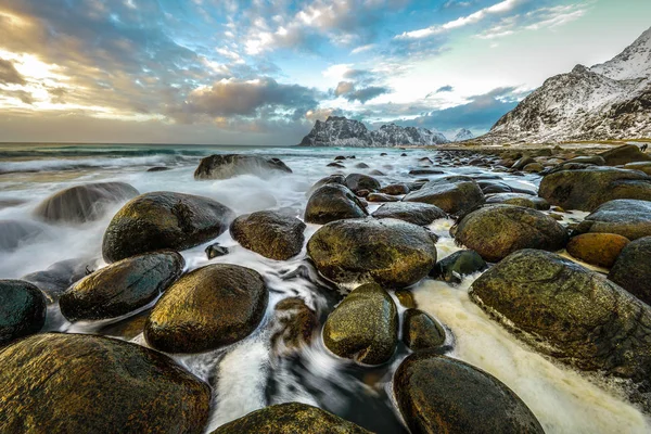 Ancient stones on the shores of cold Norwegian Sea at evening time. Lofoten islands. Beautiful Norway landscape. — Stock Photo, Image