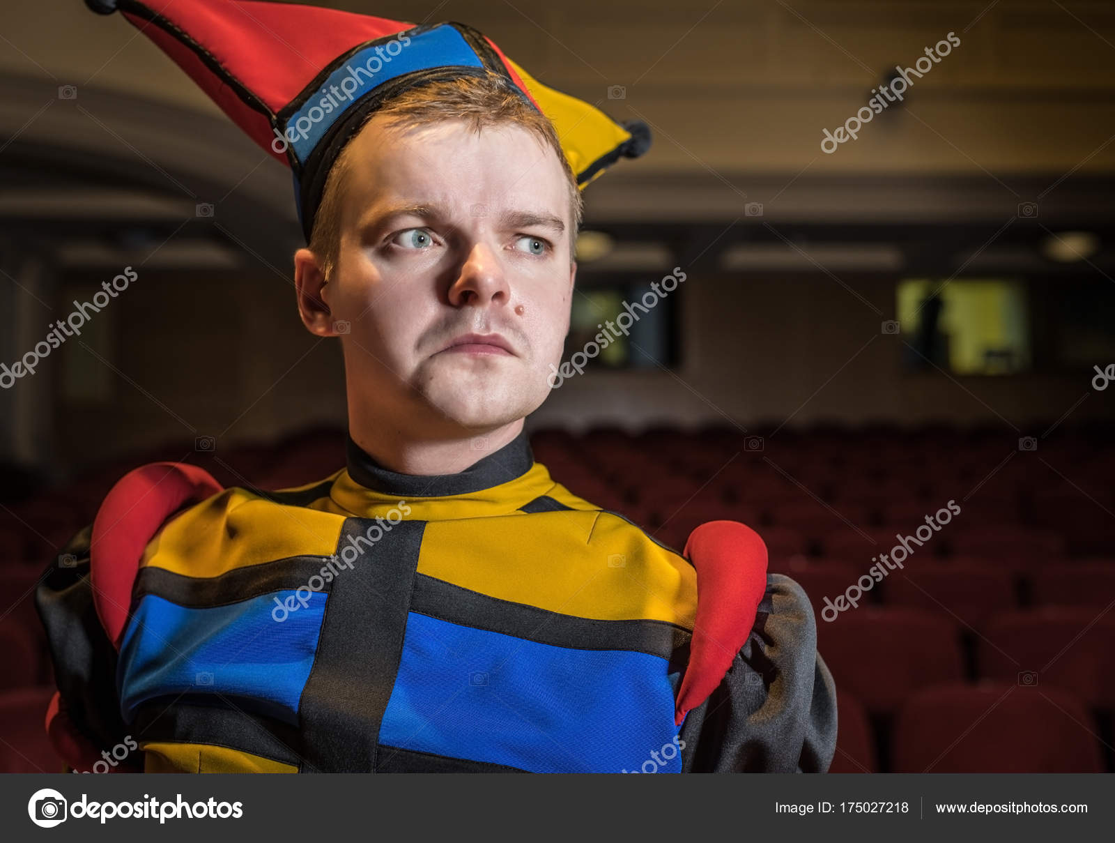 Actor dressed jester's costume in interior of old theater. — Stock