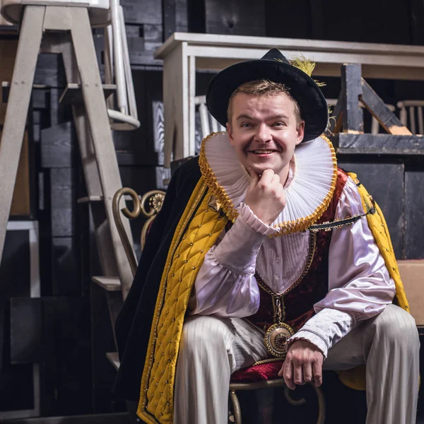 Actor dressed historical costume in interior of old theater. — Stock Photo, Image