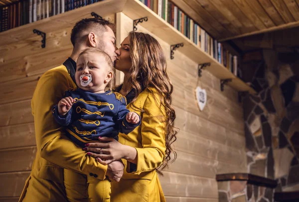 Young happy family together in interior of house. — Stock Photo, Image