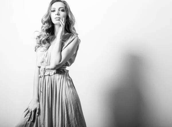 Young beautifull woman in silk dress black-white studio portrait. — Stock Photo, Image