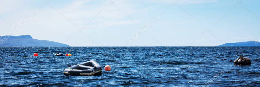 Beautiful scenic landscape of amazing Scotland nature with fishing boat.