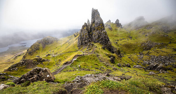 Old Man of Storr on the Isle of Skye in Scotland. Mountain landscape with foggy clouds.