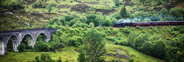 SCOTLAND, UNITED KINGDOM - MAY 30, 2019: The Hogwarts Express is the name of the train that makes a run between London, King's Cross Station Platform 9. 