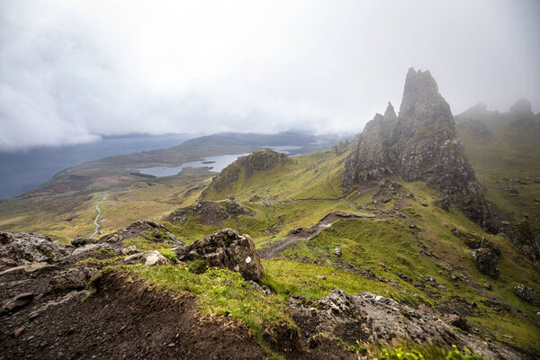 Old Man of Storr on the Isle of Skye in Scotland. Mountain landscape with foggy clouds.