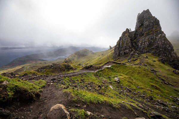 Old Man of Storr on the Isle of Skye in Scotland. Mountain landscape with foggy clouds.