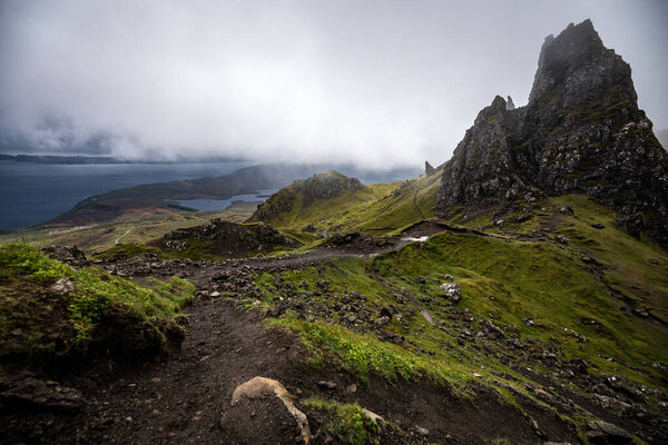 Old Man of Storr on the Isle of Skye in Scotland. Mountain landscape with foggy clouds.