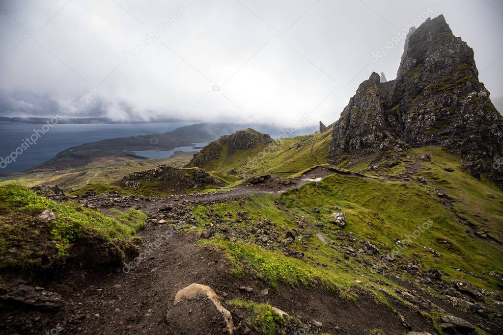 Old Man of Storr on the Isle of Skye in Scotland. Mountain landscape with foggy clouds.