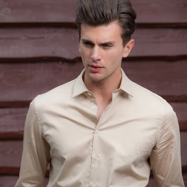 Portrait of handsome young man on wooden background. — Stock Photo, Image