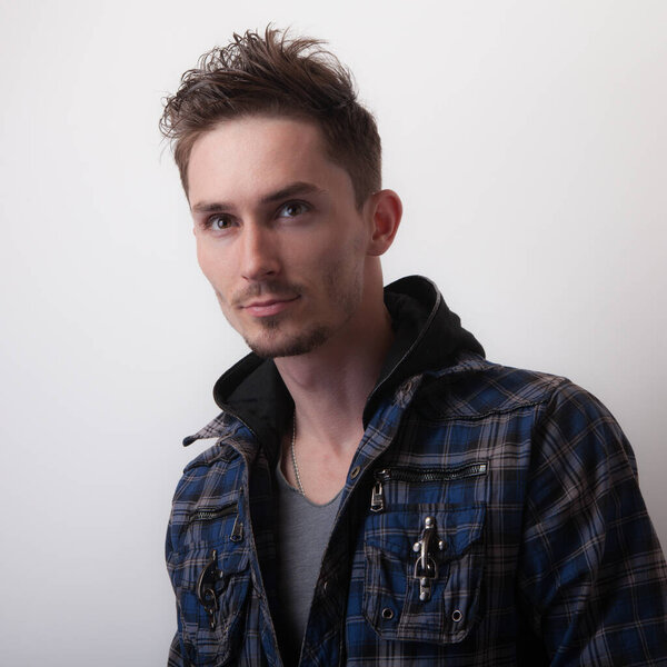 Handsome young elegant man studio portrait.