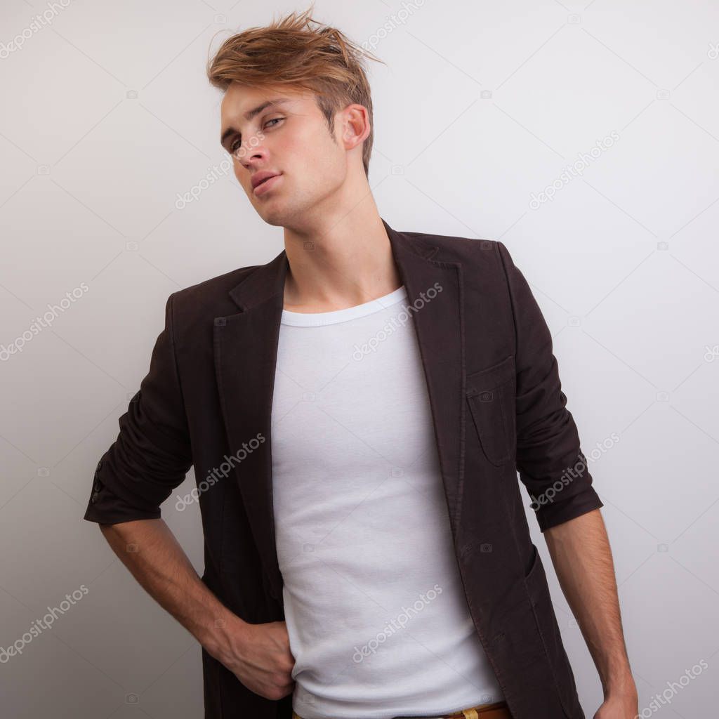 Handsome young elegant man studio portrait.